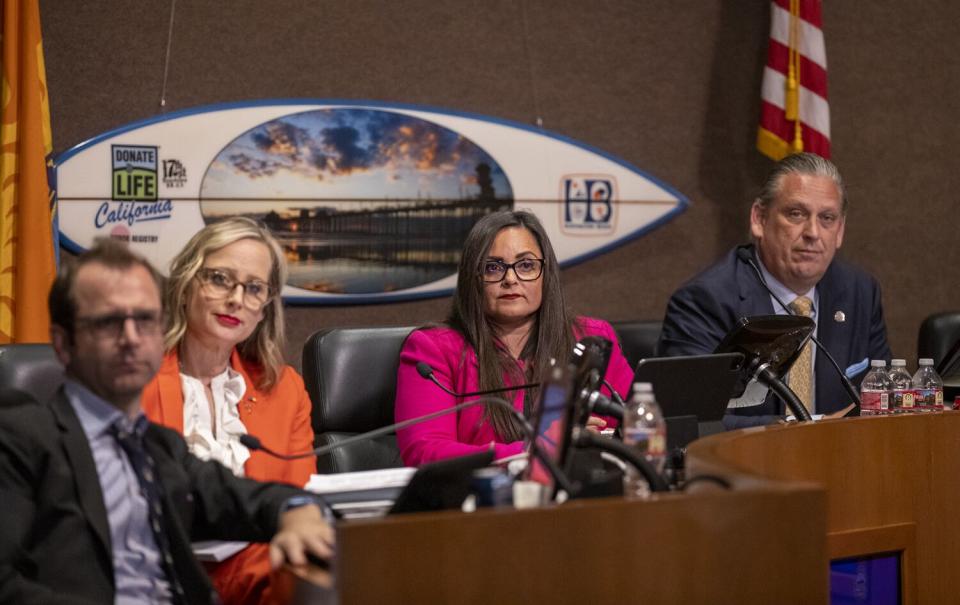 Gracey Van Der Mark surrounded by members of the Huntington Beach City Council