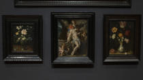 Bartholomeus Spanger's "Body of Christ Supported by Angels" oil on copper painting, center, which went on display at the Rijksmuseum in Amsterdam, Netherlands, Monday, June 1, 2020. The cultural institution received the gift of the major painting to underscore support for the victims of the coronavirus pandemic and the crisis that museums face world wide. The Dutch government took a major step to relax the coronavirus lockdown, with bars, restaurants, cinemas and museums reopening under strict conditions. (AP Photo/Peter Dejong)