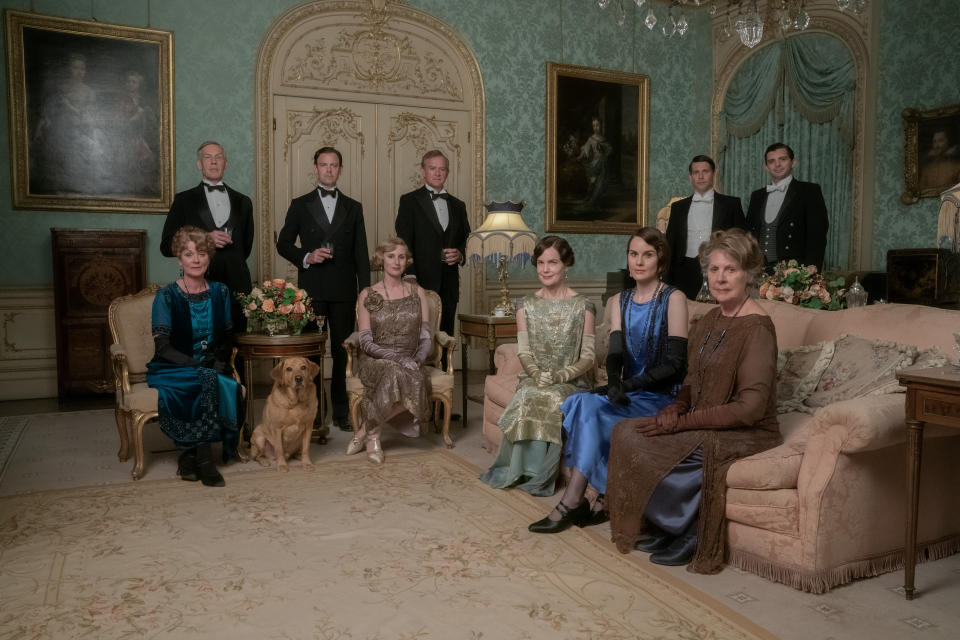 Samantha Bond stars as Lady Rosamund, Douglas Reith as Lord Merton, Harry Hadden-Paton as Lord Hexham, Laura Carmichael as Lady Edith Hexham, Hugh Bonneville as Lord Grantham, Elizabeth McGovern as Lady Grantham, Michelle Dockery as Lady Mary Talbot, Penelope Wilton as Lady Merton, Robert James Collier as Thomas Barrow and Michael Fox as Andy in DOWNTON ABBEY: A New Era, a Focus Features release.  Credit: Ben Blackall / Â© 2021 Focus Features, LLC