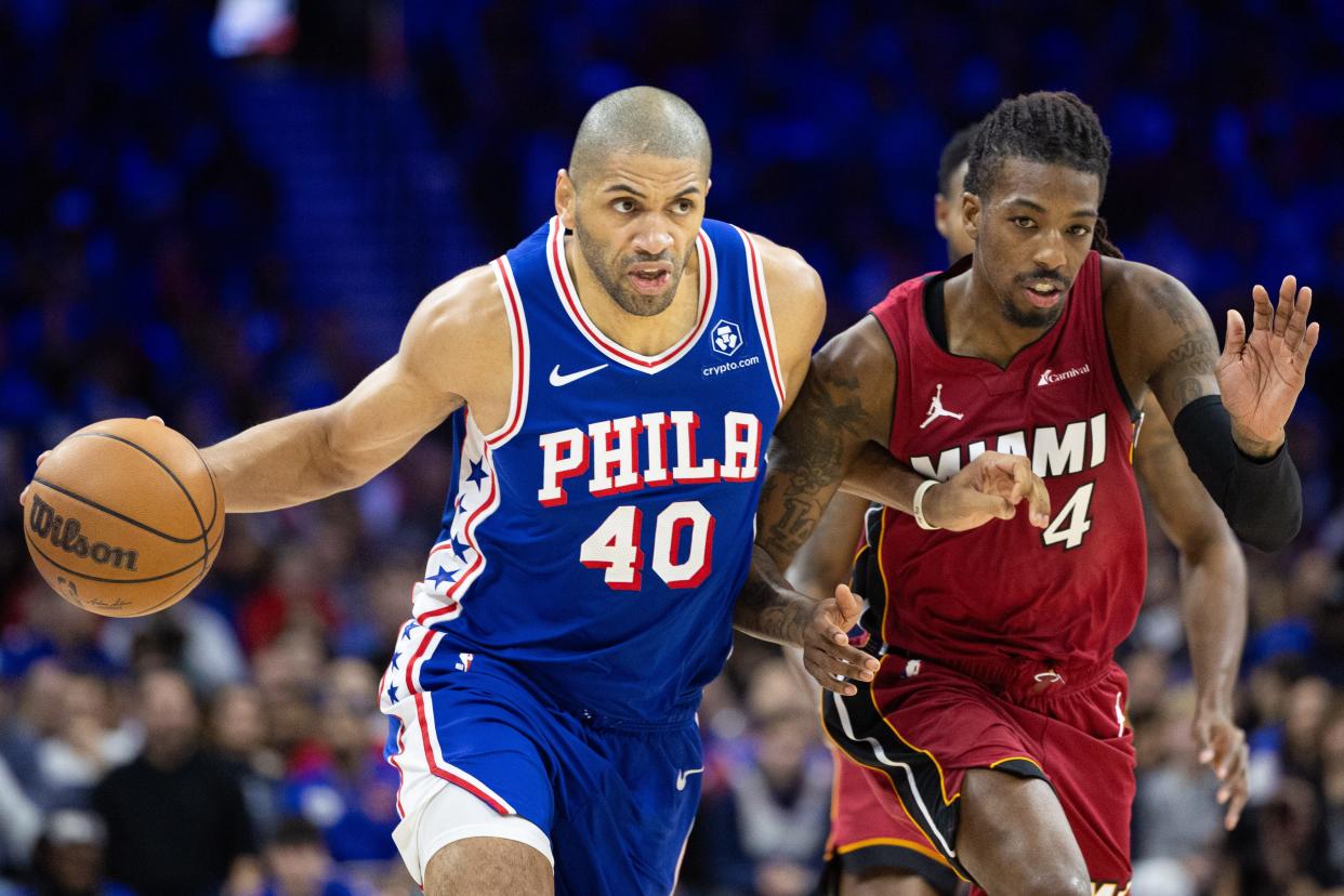 Nicolas Batum hit six 3-pointers and finished with 20 points off the bench to help the 76ers defeat the Heat in a play-in game.