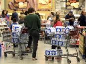 Customers stand in line to pay for cases of water at an H-E-B store Thursday, Dec. 15, 2016, in Corpus Christi, Texas. The city is warning its 320,000 residents not to use tap water because it might be contaminated with petroleum-based chemicals, prompting a rush on bottled water and the closure of local schools. (Gabe Hernandez/Corpus Christi Caller-Times via AP)