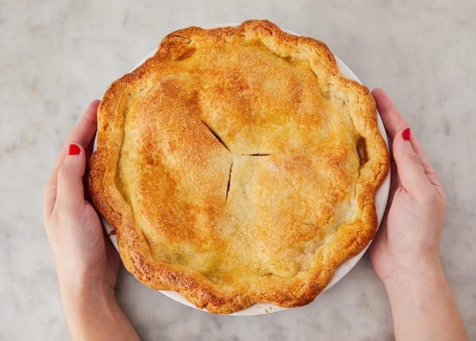 a person holding a pie