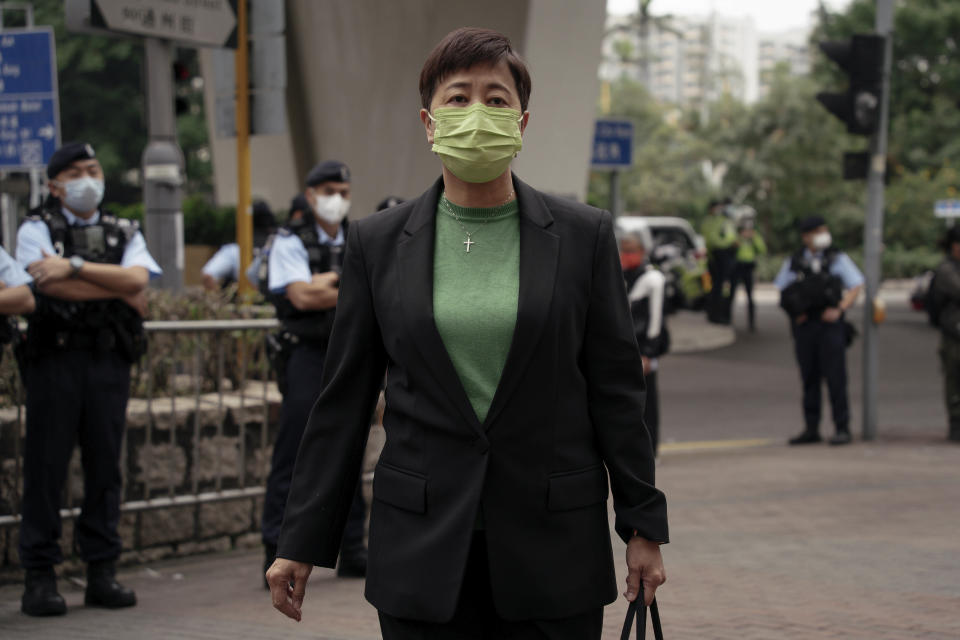 Pro-democracy activist Helena Wong Pik-wan arrives at the West Kowloon Magistrates' Courts to attend her national security trail in Hong Kong, Monday, Feb. 6, 2023. Some of Hong Kong's best-known pro-democracy activists went on trial Monday in the biggest prosecution yet under a law imposed by China's ruling Communist Party to crush dissent. (AP Photo/Anthony Kwan)