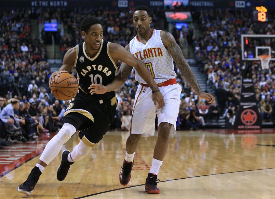 DeMar DeRozan dribbles the ball as Jeff Teague of the Atlanta Hawks defends during the first half of an NBA game at the Air Canada Centre. (Vaughn Ridley/Getty Images)