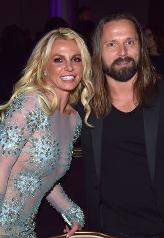 <p>Lester Cohen/WireImage</p> Britney Spears with Max Martin in Los Angeles in February 2017