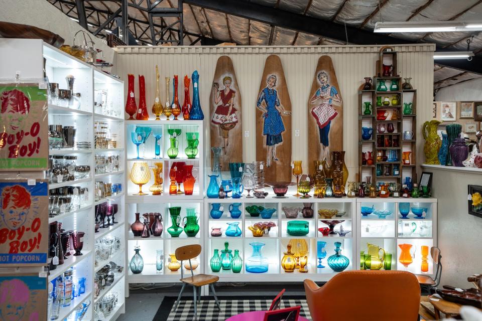 Colorful glassware sits out for sale at a vendor booth at the Livingston Antique Outlet in Howell on Monday, July 1, 2024.