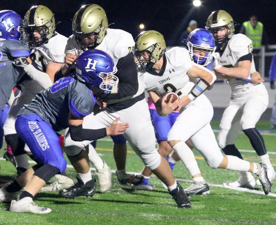 Corning's Brody Wolfe (2) runs behind his line during a 20-7 win over Horseheads in football Oct. 21, 2022 at Horseheads High School.