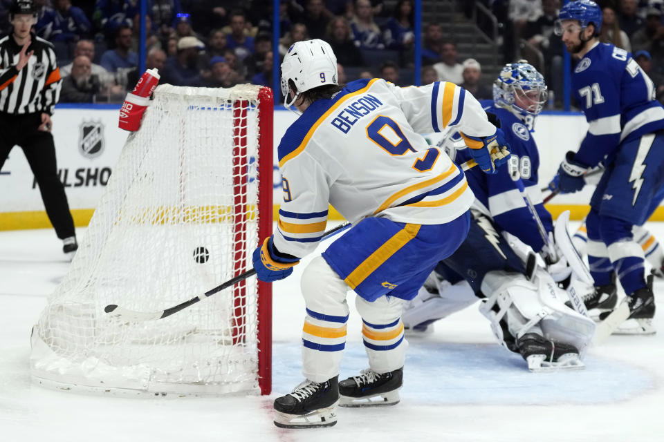 Buffalo Sabres left wing Zach Benson (9) scores past Tampa Bay Lightning goaltender Andrei Vasilevskiy (88) during the third period of an NHL hockey game Monday, April 15, 2024, in Tampa, Fla. (AP Photo/Chris O'Meara)