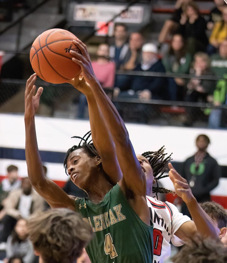 GlenOak’s Jaylen McElroy grabs a rebound against McKinley on Friday, Dec. 9, 2022.
(Photo: Bob Rossiter / Special to The Canton Repository)