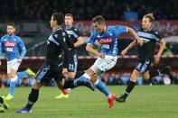 Napoli's forward Arkadiusz Milik, centre controls the ball, during the Italian Serie A soccer match between SSc Napoli and SS Lazio at the San Paolo stadium in Naples, Sunday, Jan. 20, 2019. (Cesare Abbate/Ansa via AP)