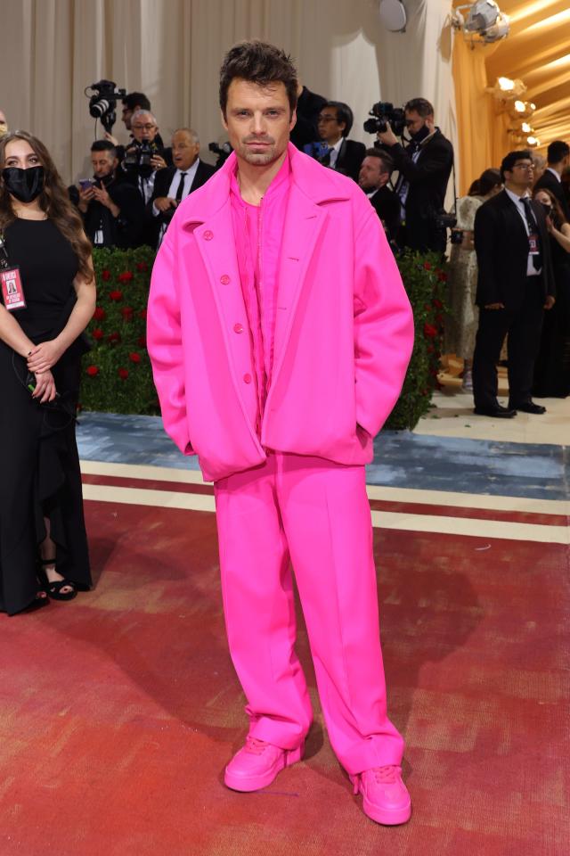 Sebastian in an all-bright pink ensemble of an oversized jacket, shirt, trousers, and matching chunky sneakers.