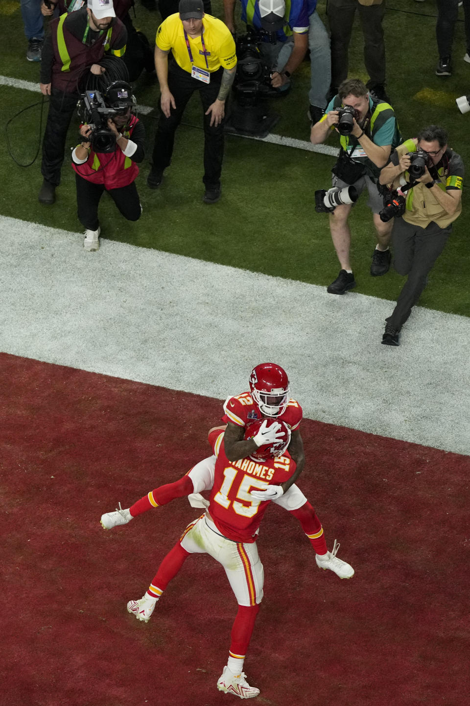 Kansas City Chiefs quarterback Patrick Mahomes (15) celebrates with wide receiver Mecole Hardman Jr. after throwing the game-wining touchdown during overtime of the NFL Super Bowl 58 football game against the San Francisco 49ers Sunday, Feb. 11, 2024, in Las Vegas. (AP Photo/David J. Phillip)