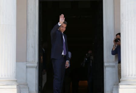 Newly-appointed Greek Prime Minister Mitsotakis meets with outgoing Prime Minister Tsipras in Athens