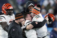 Cincinnati Bengals kicker Evan McPherson (2) celebrates his game-winning field goal against the Tennessee Titans with Cincinnati Bengals quarterback Joe Burrow (9) after an NFL divisional round playoff football game, Saturday, Jan. 22, 2022, in Nashville, Tenn. The Cincinnati Bengals won 19-16.(AP Photo/Mark Humphrey)