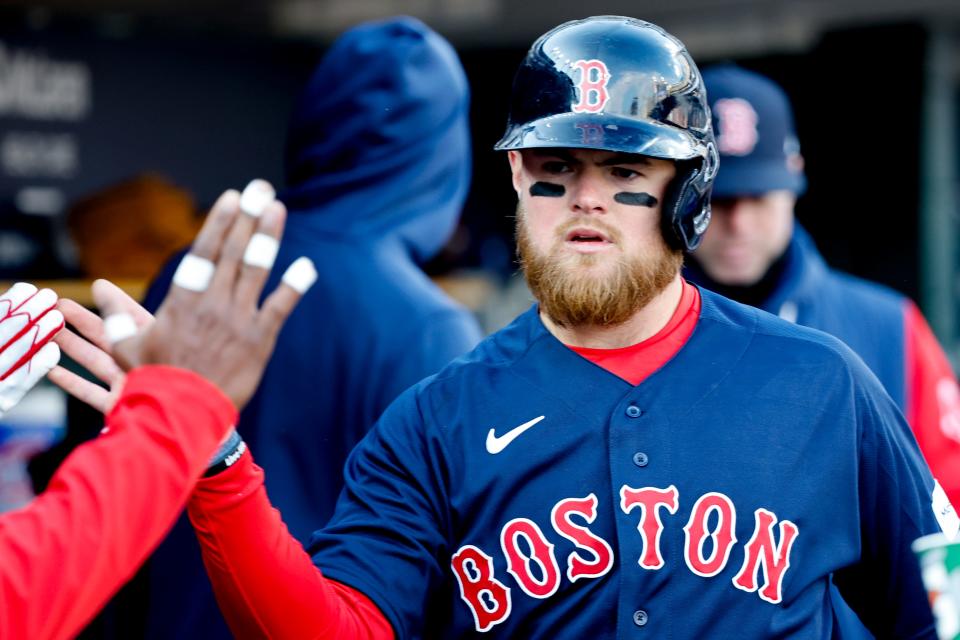 Boston Red Sox second baseman Christian Arroyo (39) receives congratulations from teammates after scoring in the eighth inning against the Detroit Tigers at Comerica Park in Detroit on Saturday, April 8, 2023.