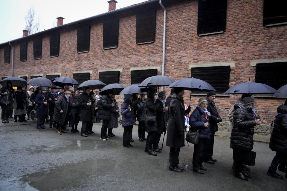 Holocaust survivors and relatives arrive at the Auschwitz Nazi death camp in Oswiecim, Poland, Saturday, Jan. 27, 2024. Survivors of Nazi death camps marked the 79th anniversary of the liberation of the Auschwitz-Birkenau camp during World War II in a modest ceremony in southern Poland.(AP Photo/Czarek Sokolowski)