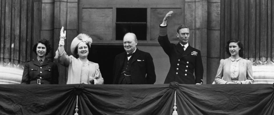 Prime Minister Winston Churchill appears on the balcony at Buckingham Palace together with King George VI and Queen Elizabeth and the two princesses on the afternoon of V-E Day, May 8, 1945. (Photo by CORBIS/Corbis via Getty Images)