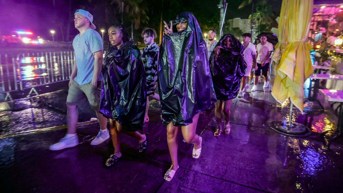 A downpour dampens spring break party along Ocean Drive before midnight curfew on Miami Beach, Florida on Sunday, March 17, 2024.