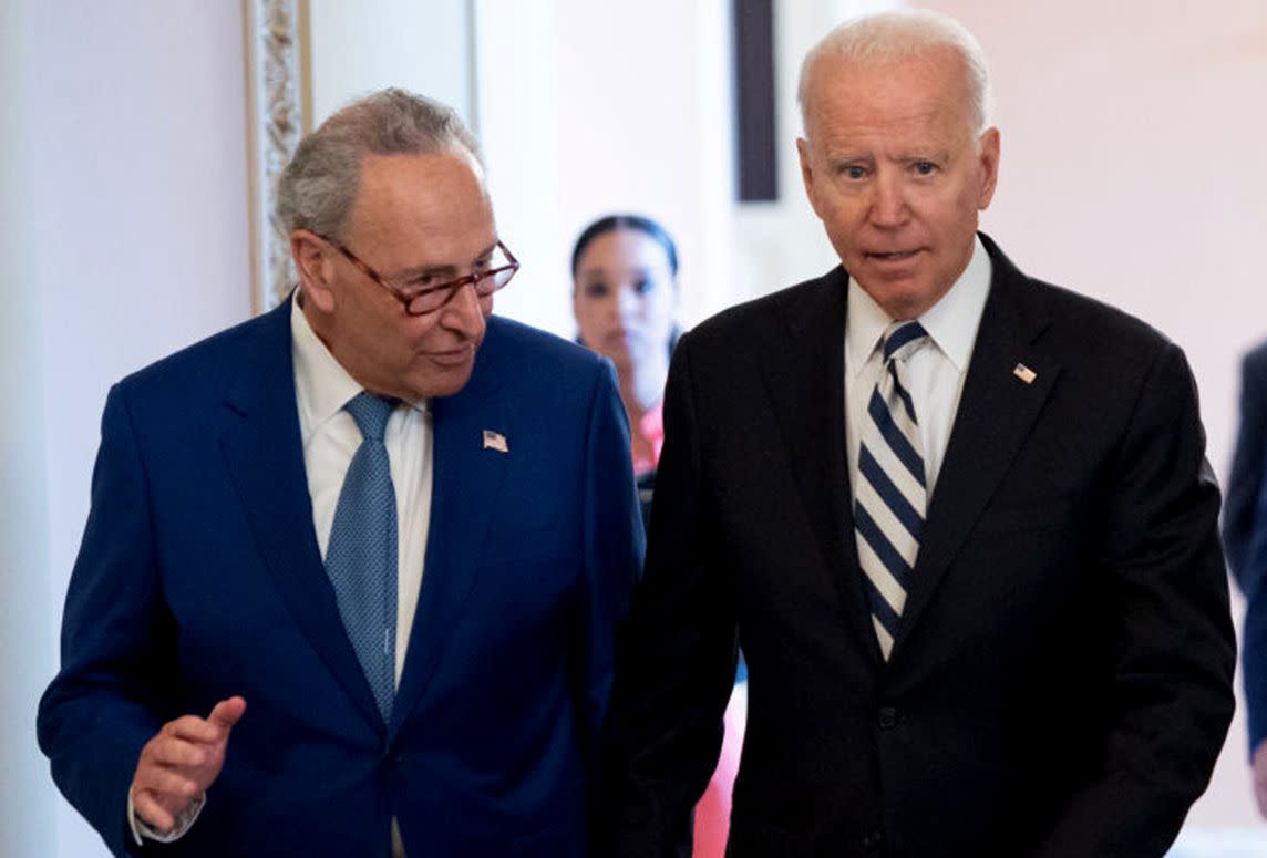 In this file photo, President Biden is with Senate Majority Leader Chuck Schumer (D-N.Y.), left, on July 13, 2021, in Washington.