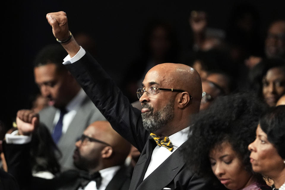 The Rev. Frederick D. Haynes III raises his fist at the opening of a ceremony in Dallas, Thursday, Feb. 1, 2024. The civil rights group founded by the Rev. Jesse Jackson in the 1970s is elevating a new leader for the first time in more than 50 years, choosing Haynes as his successor to take over the Rainbow PUSH Coalition. (AP Photo/LM Otero)