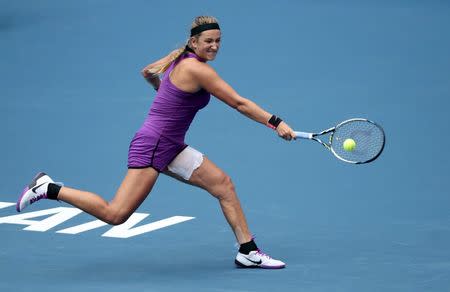 Victoria Azarenka of Belarus returns a shot to Lauren Davis of the U.S. during their women's singles match at the Wuhan Open tennis tournament, Hubei province, China, September 27, 2015. REUTERS/China Daily