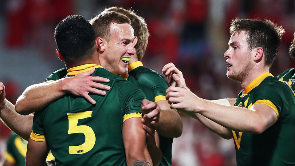 Valentine Holmes of Australia (L) celebrates with Daly Cherry-Evans (C) during the rugby league international Test match between Australia and Tonga at Mt Smart Stadium. Pic: Getty