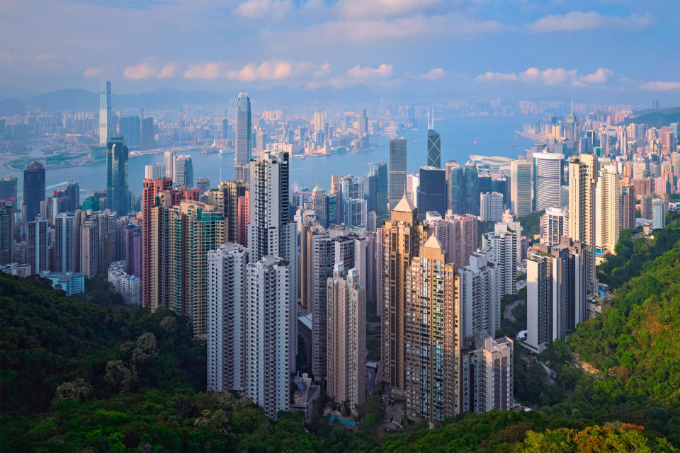 Hong Kong skyscrapers skyline cityscape view from Victoria Peak on sunset. (Photo: Getty Images)