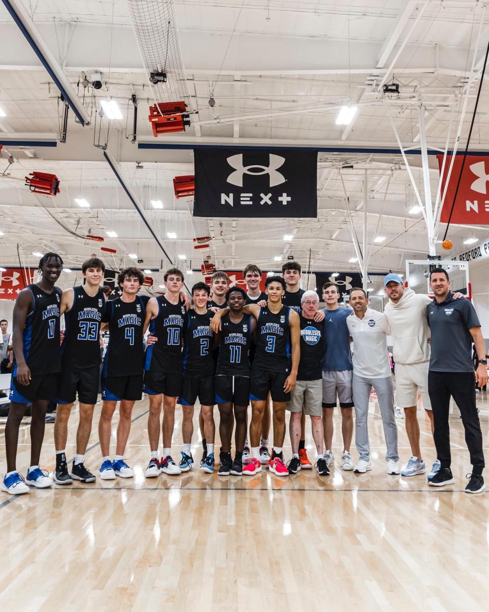 Marquette point guard Tyler Kolek, left, AAU coach Mike Crotty and Bucks guard Pat Connaughton pose for a photo at the Under Armour Next tournament in Chicago in 2022.