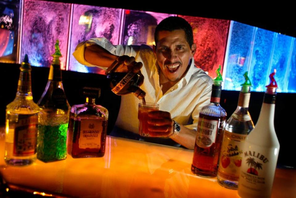 In 2004, Club Deep bartender and marketing director Auggie Mejia shows how to make South Beach Punch.
