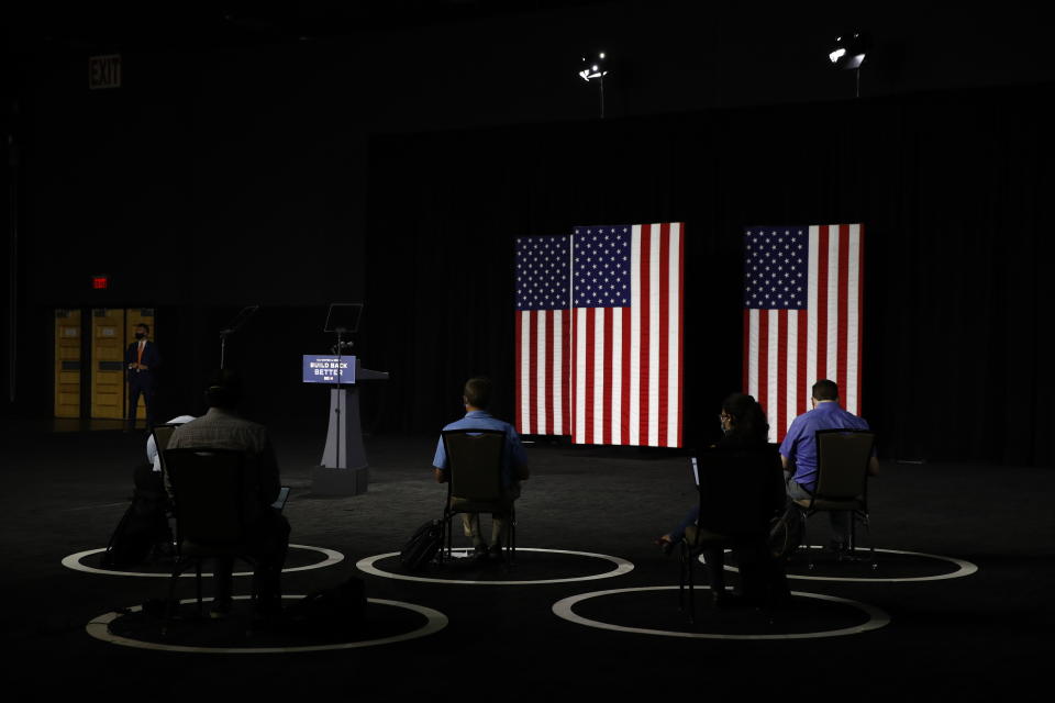 People wait for Democratic presidential candidate, former Vice President Joe Biden to speak at a campaign event, Tuesday, July 14, 2020, in Wilmington, Del. (AP Photo/Patrick Semansky)