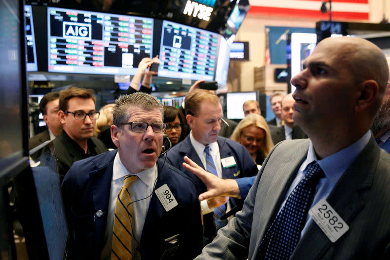 Traders work on the floor of the New York Stock Exchange (NYSE) in New York City, U.S. October 31, 2016. REUTERS/Brendan McDermid