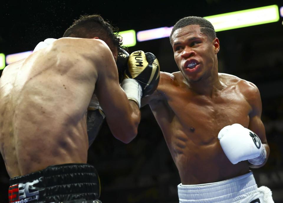 Devin Haney, right, punches Jorge Linares during the WBC lightweight title boxing match on May 29, 2021, in Las Vegas.