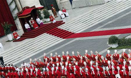 Pope Francis leads the Palm Sunday mass at Saint Peter's Square at the Vatican April 13, 2014. REUTERS/Giampiero Sposito