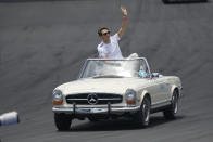 George Russell waves to the crowd during the drivers parade before during the Formula One Miami Grand Prix auto race at the Miami International Autodrome, Sunday, May 7, 2023, in Miami Gardens, Fla. (AP Photo/{sum}) (AP Photo/Wilfredo Lee)