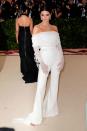 <p>The Californian beauty wore an off-the-shoulder white long-sleeve Off-White bustier with a matching set of wide-leg trousers teamed with a set of gloves and Tiffany & Co. jewels for the Met Gala. </p><p>The theme? 'Heavenly Bodies: Fashion & The Catholic Imagination Costume Institute Gala', May 2018</p>