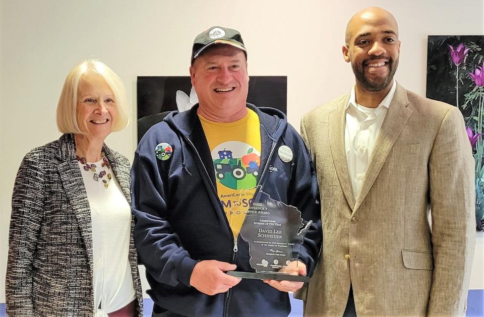 David Lee Schneider of Oconto holds AmeriCorps Member of the Year Award he was presented May 26 at the 2022 Governor's Service Awards at Olbrich Botanical Gardens in Madison. Wisconsin first lady Kathy Evers and Lt. Gov. Mandela Barnes were on hand to congratulate the winners.