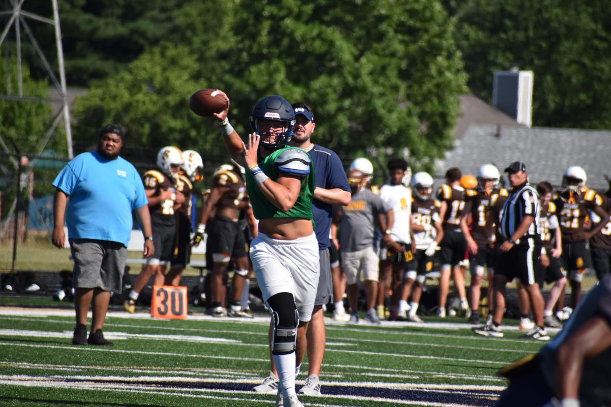 Decatur Central quarterback Aycen Stevens fires a pass during the Hawks' four-way scrimmage with Bloomington North, Castle and Speedway on June 23, 2022.