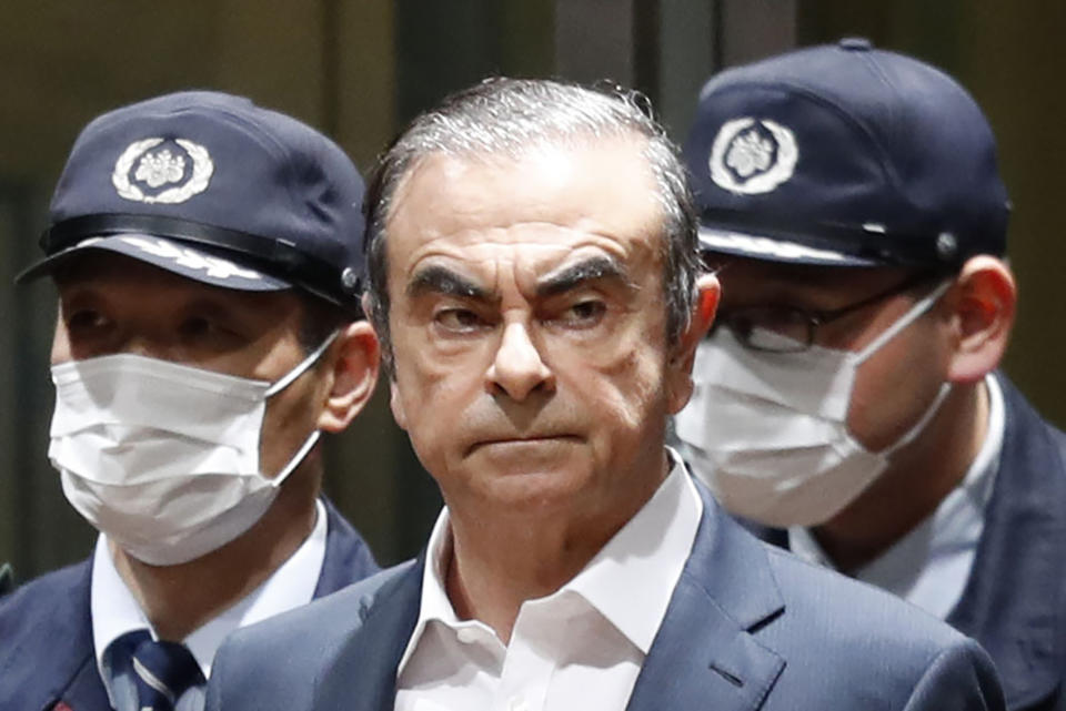 FILE - In this April 25, 2019, file photo, former Nissan Chairman Carlos Ghosn leaves Tokyo's Detention Center for bail in Tokyo. By jumping bail, Ghosn, who had long insisted on his innocence, has now committed a clear crime and can never return to Japan without going to jail. (Kyodo News via AP, File)