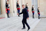 Le Drian, Vitorino, Castaner, Macron, Avramopoulos and Grandi deliver a joint statement at the Elysee Palace in Paris