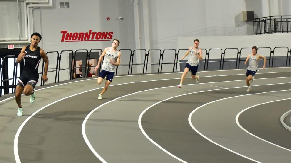 a group of people running on a track