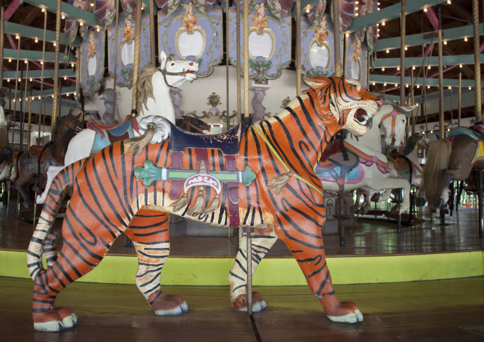 This June 19, 2013 photo provided by the NYC Landmarks Preservation Commission shows the 1910 Forest Park Carousel in the Queens borough of New York. The carousel, featuring 46 hand-carved horses, a lion, tiger and deer, is the city's first carousel to get the designation from Landmarks Preservation Commission. (AP Photo/NYC Landmarks Preservation Commission, Christopher D. Brazee)