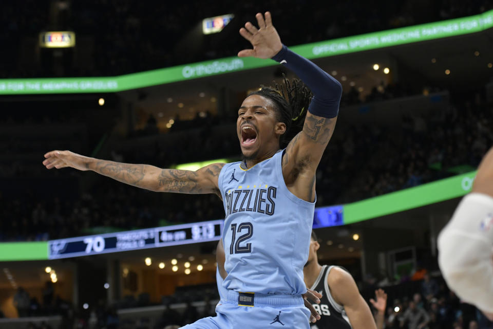 Memphis Grizzlies guard Ja Morant (12) reacts in the second half of an NBA basketball game against the San Antonio Spurs, Tuesday, Jan. 2, 2024, in Memphis, Tenn. (AP Photo/Brandon Dill)