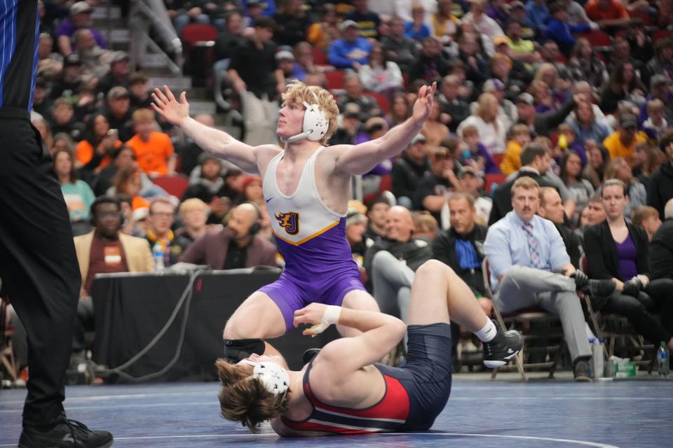 Johnston's Jacob Helgeson and Urbandale's Gabe Carver during the 3A-165 final on Feb. 17 at Wells Fargo Arena.