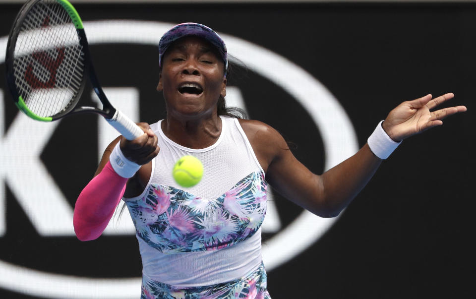 United States' Venus Williams makes a forehand return to Romania's Mihaela Buzarnescu during their first round match at the Australian Open tennis championships in Melbourne, Australia, Tuesday, Jan. 15, 2019. (AP Photo/Mark Schiefelbein)