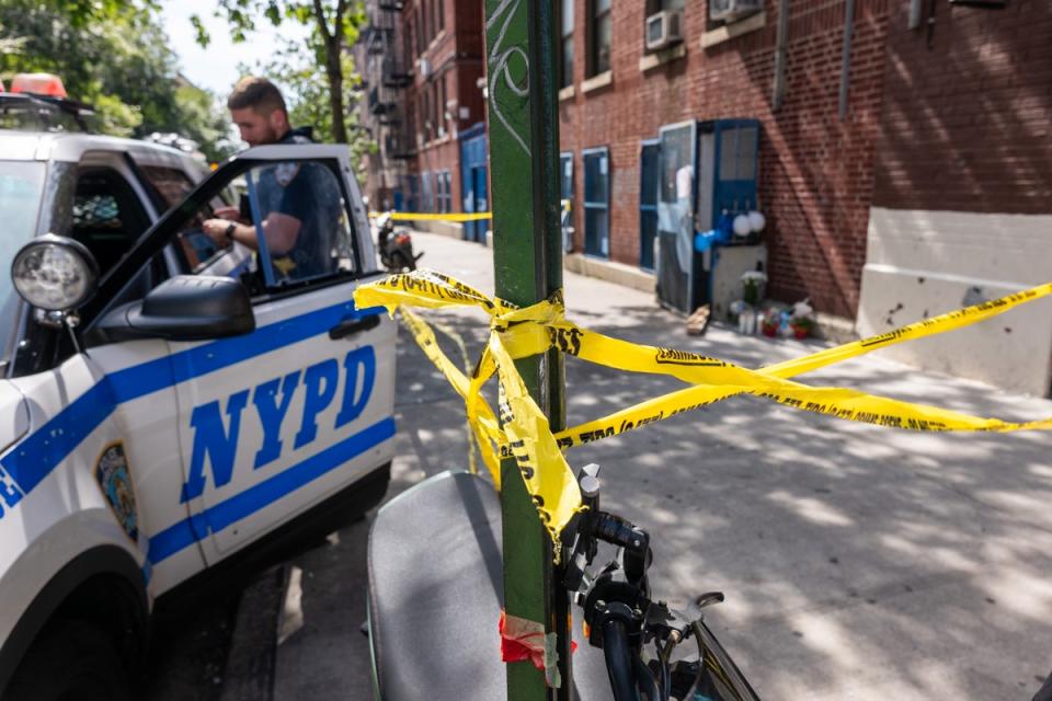 Police and crime scene investigators work at a Bronx daycare centre (Getty Images)