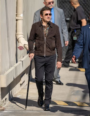 <p>RB/Bauer-Griffin/GC Images</p> Jeremy Renner walking with a cane