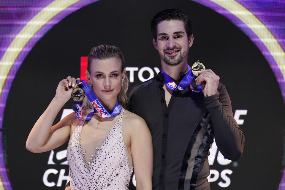 First place finishers Madison Hubbell and Zachary Donohue pose with their medals in the championship ice dance at the U.S. Figure Skating Championships, Saturday, Jan. 16, 2021, in Las Vegas. (AP Photo/John Locher)