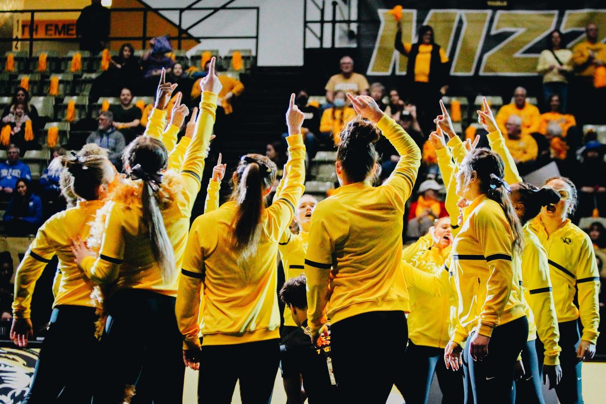 The Missouri gymnastics team gathers at the middle of the mat before a match against Kentucky on Feb. 3, 2023, in Columbia, Mo.