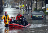 Emergency workers rescue residents of Little Ferry, New Jersey, from flood waters brought by Superstorm Sandy. (Reuters/Adam Hunger)