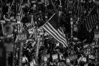 <p>Delegates wave flags during the DNC in Philadelphia, PA. on Jauly 28, 2016. (Photo: Khue Bui for Yahoo News)</p>